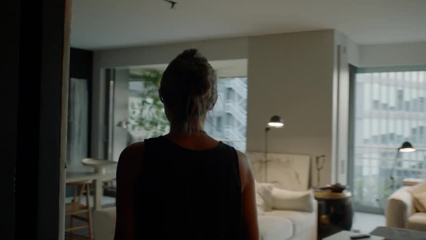 Woman walks inside home