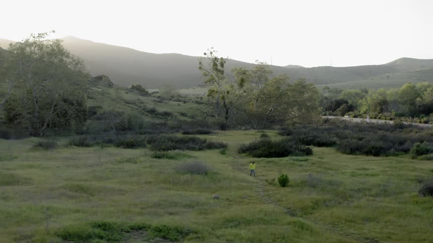 A person walks along a trail
