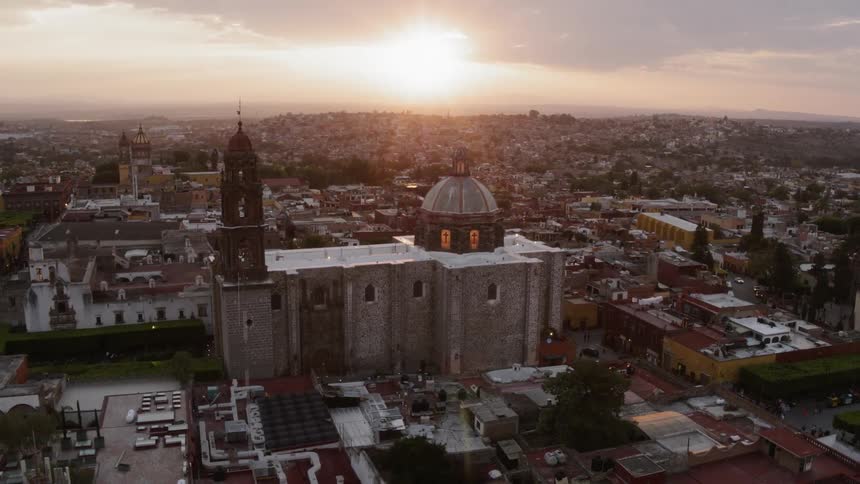 An old church sits amidst a large suburban area