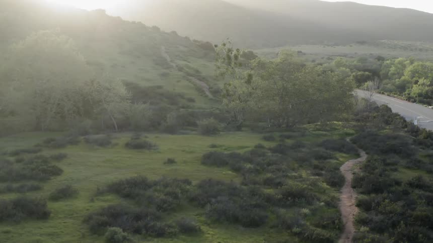A road winds through the hills