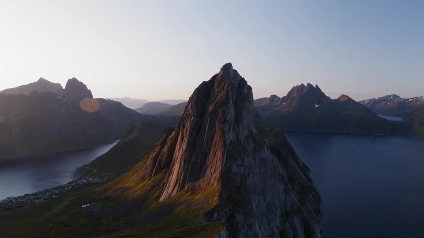 A Norwegian mountain looms high above the fjords