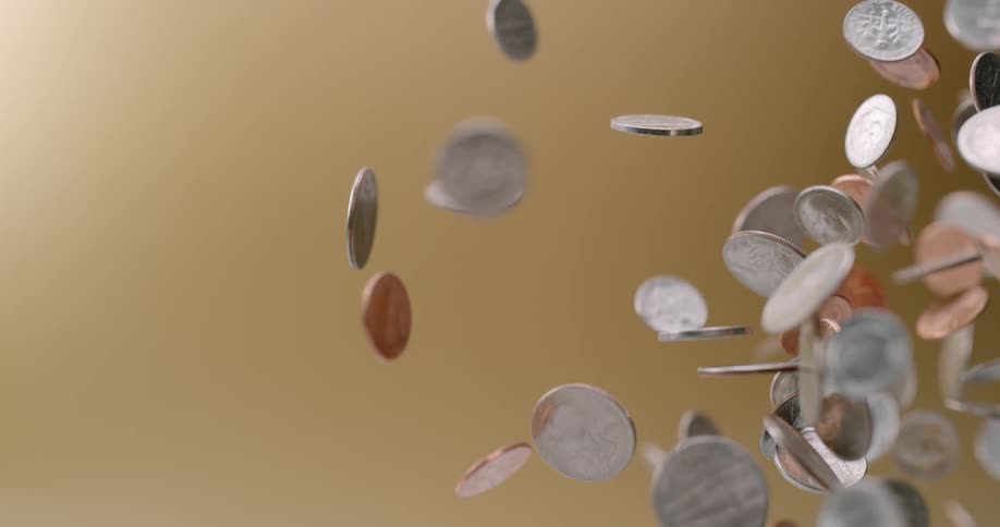 Coins being tossed up and falling down