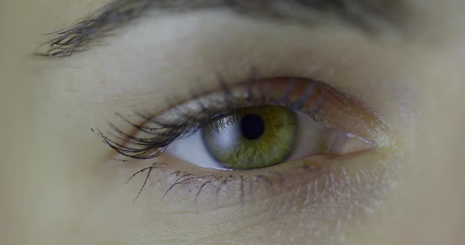 A close up of an eye opening