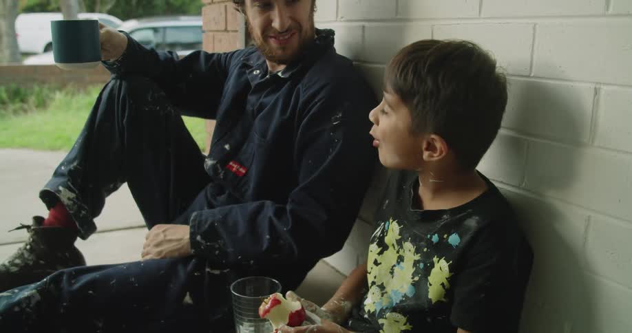 The boy eats his apple