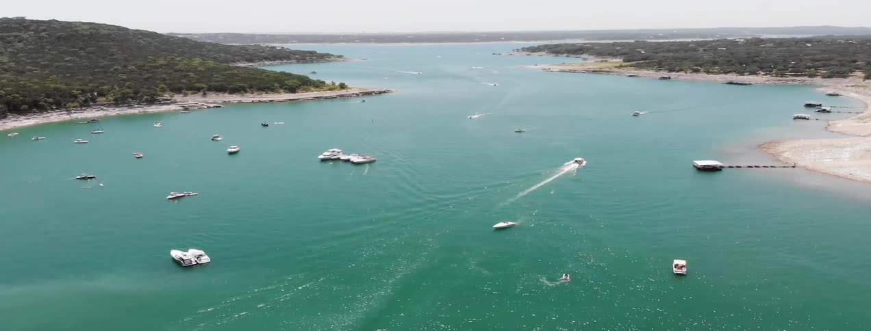 Boats travel across an inlet