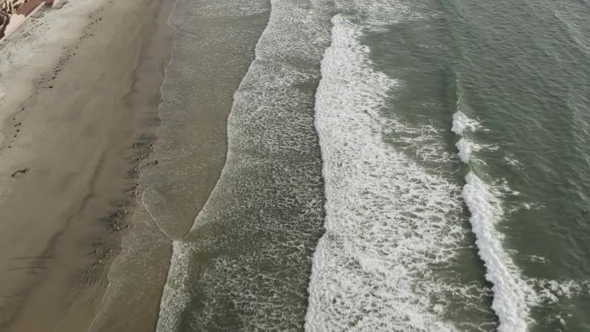 Waves wash up on a beach