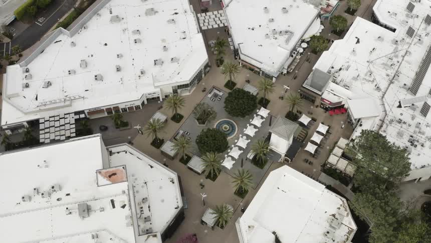 An empty shopping mall is shown from above