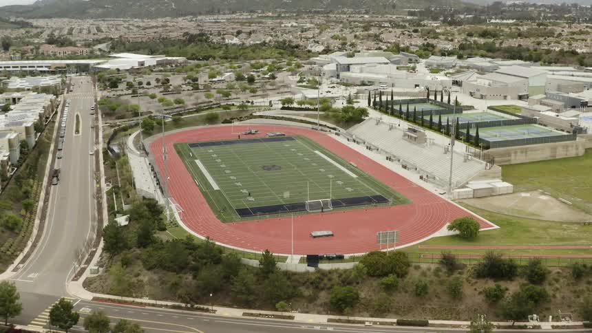 An athletics stadium with a running track surrounding a football field