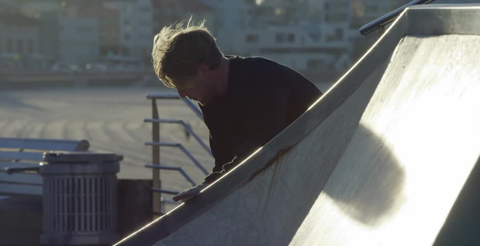 Man waxes ledge at skatepark