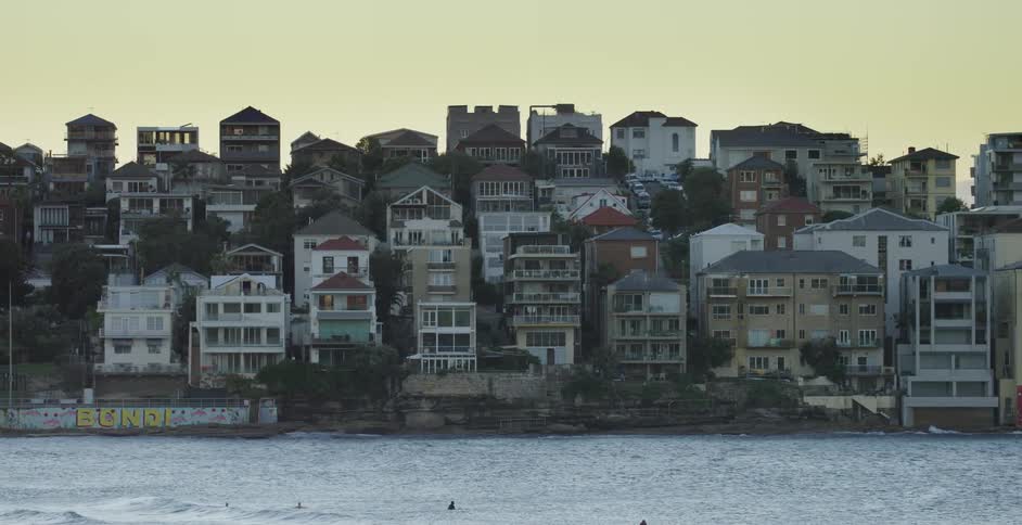 Shot of a city by the water in the evening