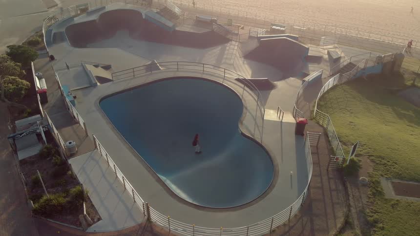 A person skates in the pool