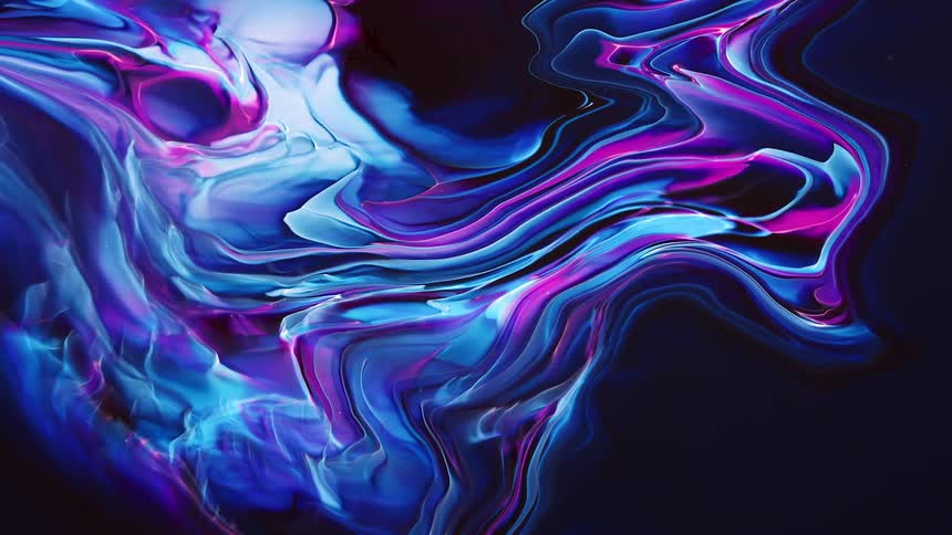 Colorful luminescent ink on water in dark room