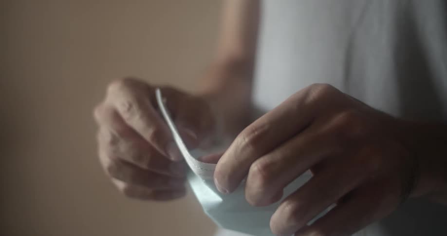 A woman preparing to put on a face mask