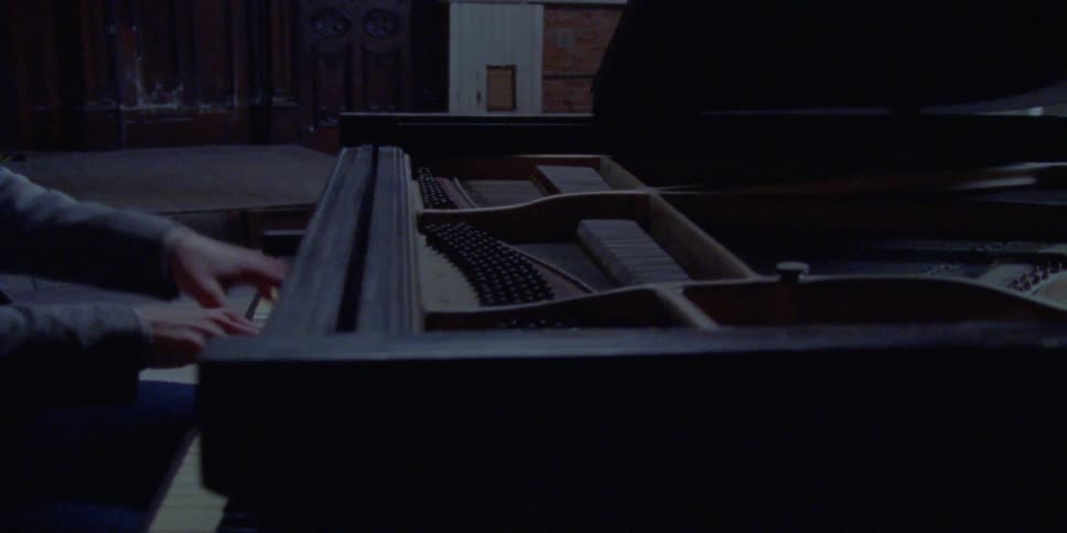 A man plays piano