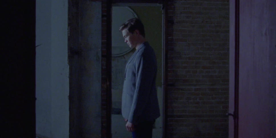 A man indoors standing up