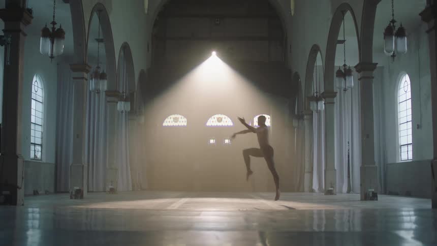 Man performs a graceful dance and jumps high