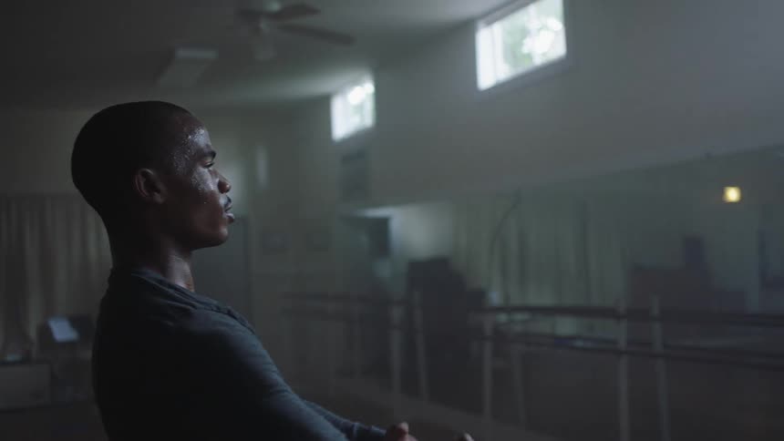 Sweaty black man dances in the basement