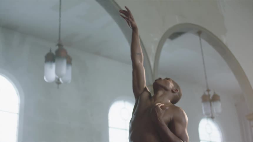 A man dances inside a room