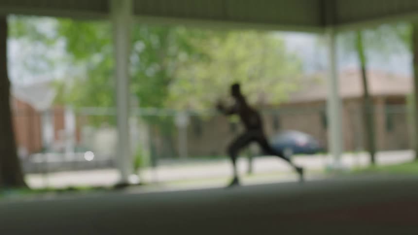 A man is running through the lot
