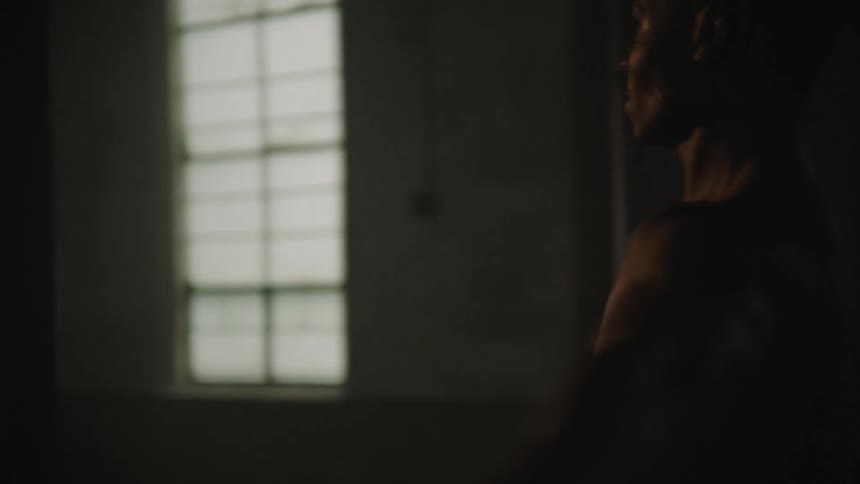 A man twirls and leaps through a ballet dance studio
