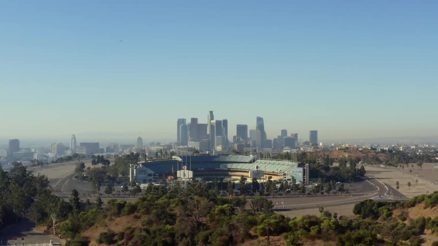 An aerial view of a skyline is displayed