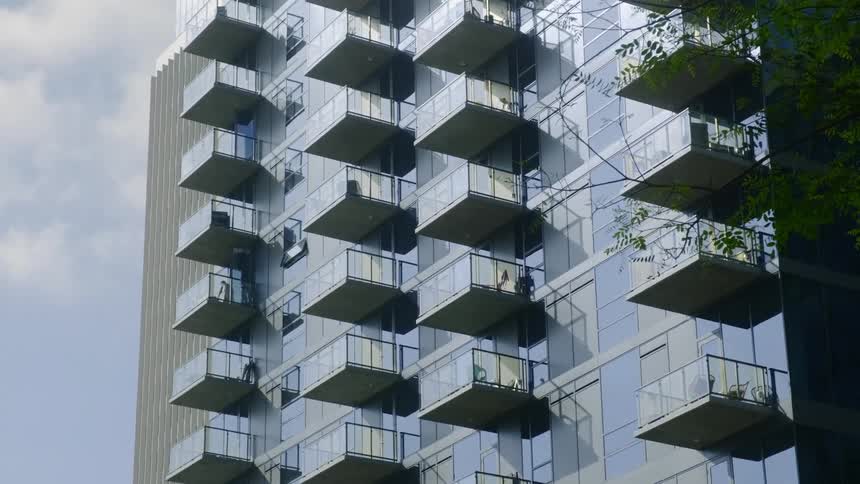A person walks out on their condo balcony