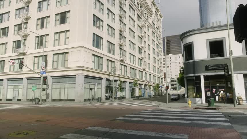 A large city intersection sits empty with no people or vehicles
