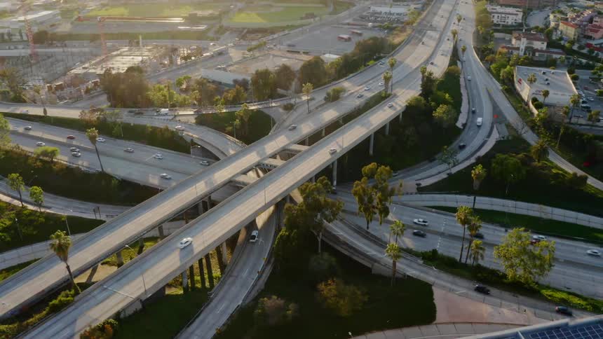 Cars driving over a complex highway overpass