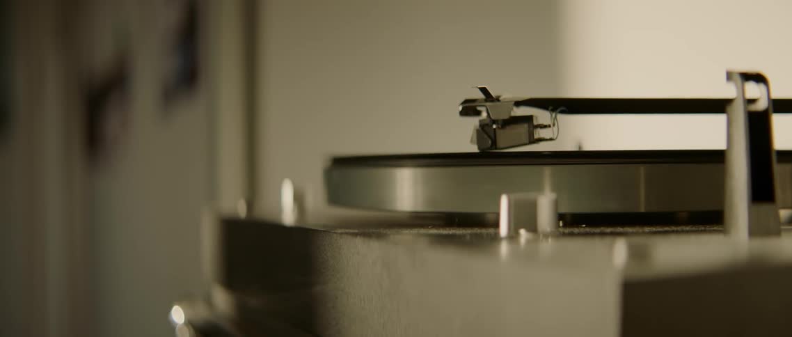 A record playing and spinning on a silver record player