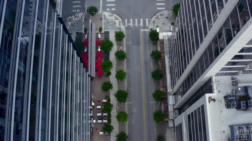 A street lined with skyscrapers in a metropolis