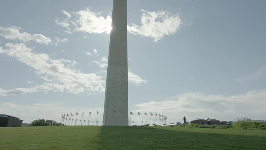 A monument surrounded by flags