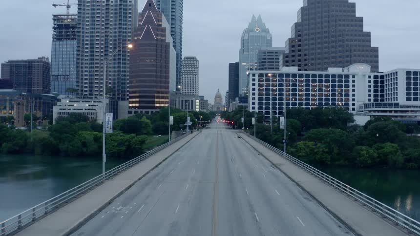 A bridge to a city sits empty