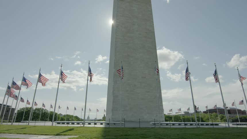A monument surrounded by flags