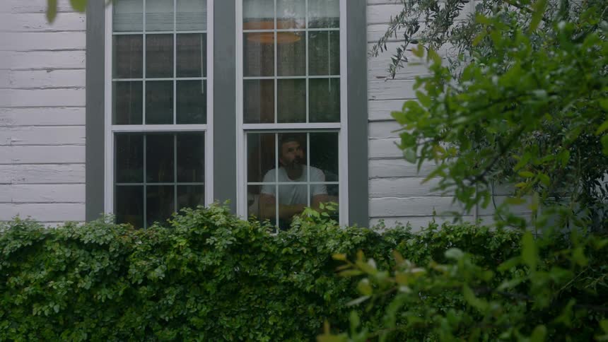 A man looks outside