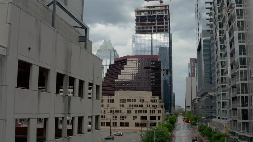 An aerial view of a downtown city is displayed