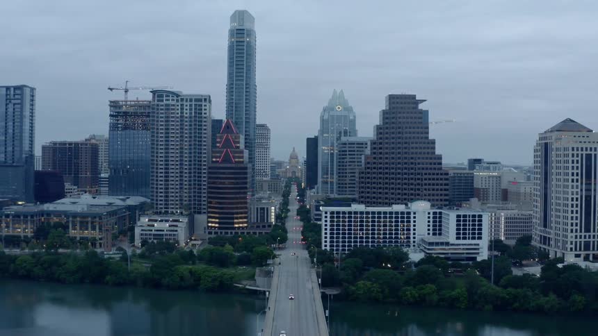 An aerial view of a downtown city is displayed
