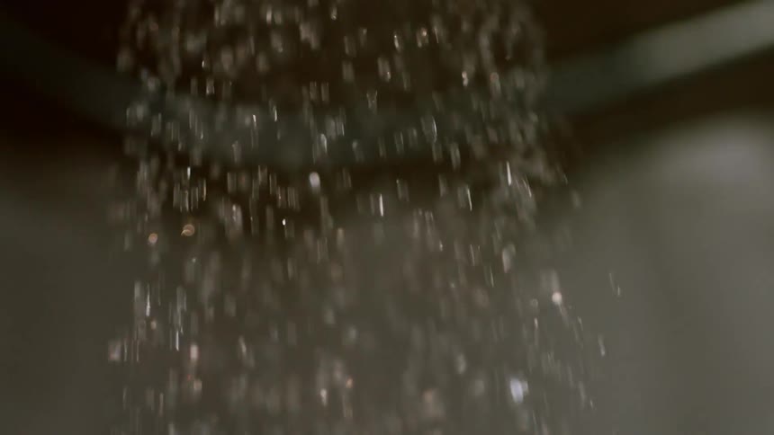 Water from a shower head flows down