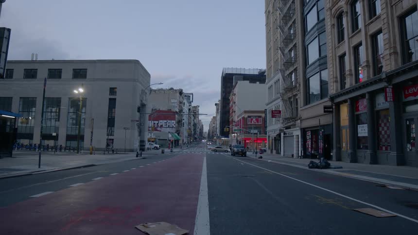 Cars driving down a city street