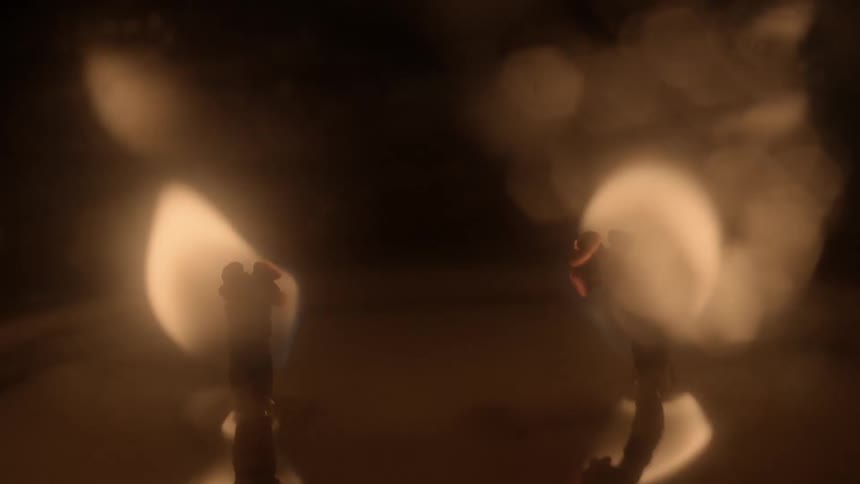 Wicks burning on a candle