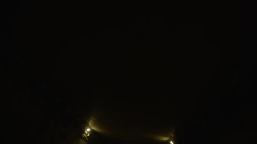 Lights are on in a dark tunnel