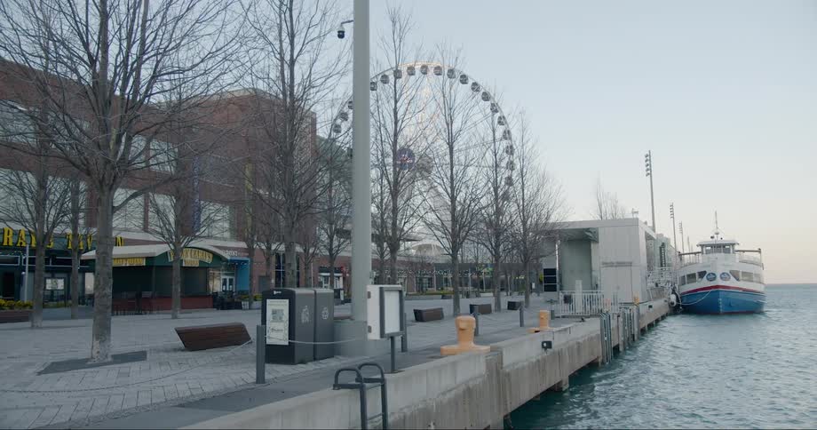 A ferry docked at an empty navy pier near harry carays tavern