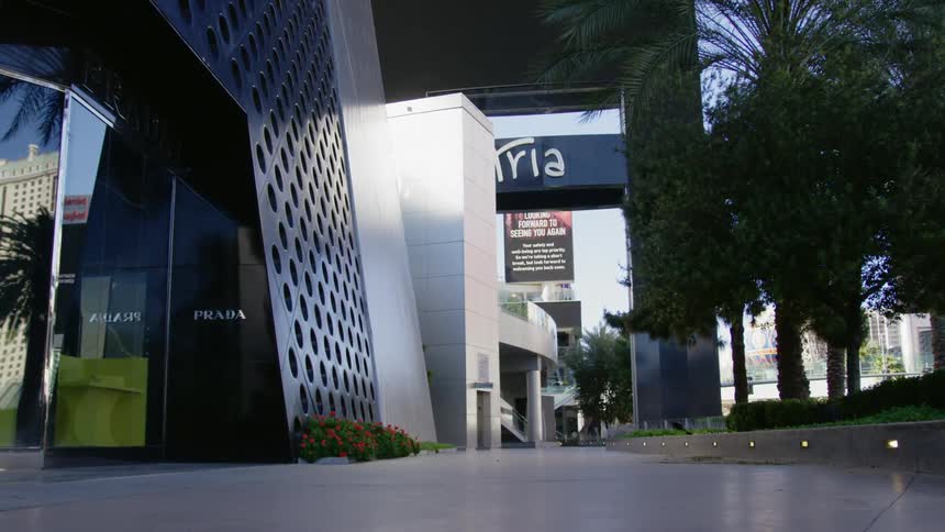 The sign flashes on the building on the empty street
