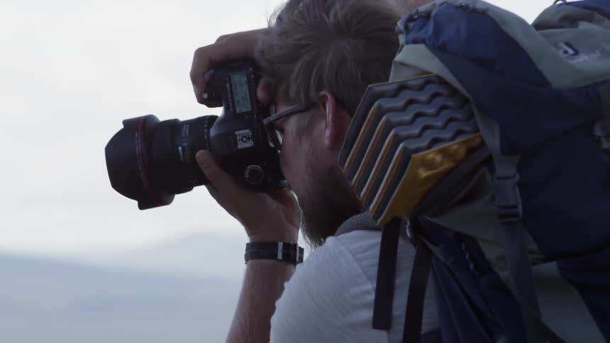 A man uses a camera