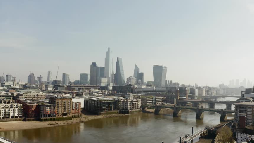 A lake in front of buildings and a city skyline