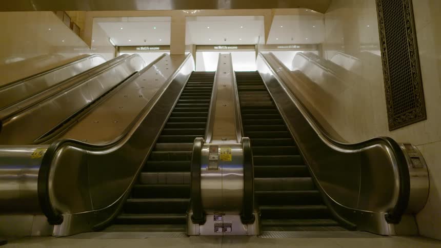 An escalator in an empty station