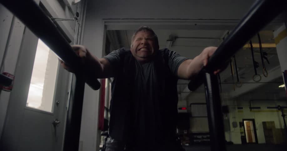 A man is working out in a gym