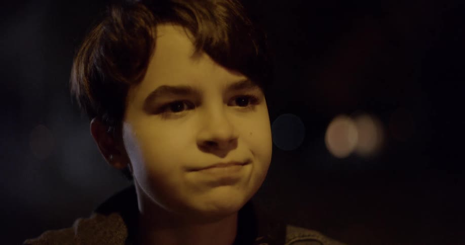 A boy looks into the darkness