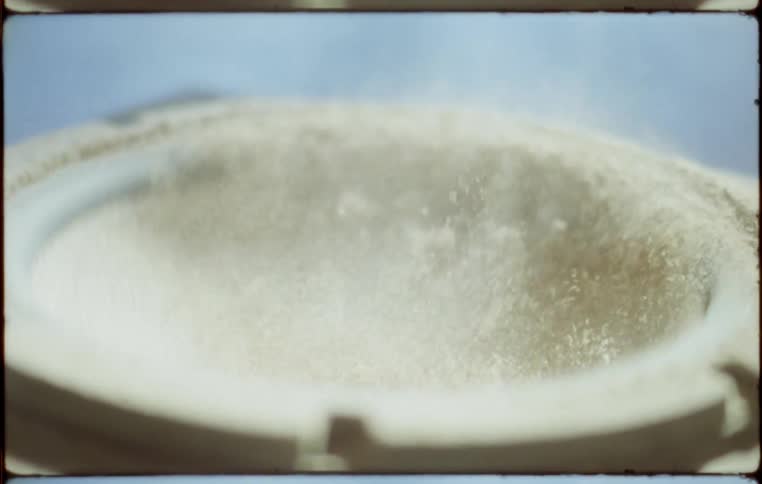 Sand and powder in a speaker jumps as it vibrates