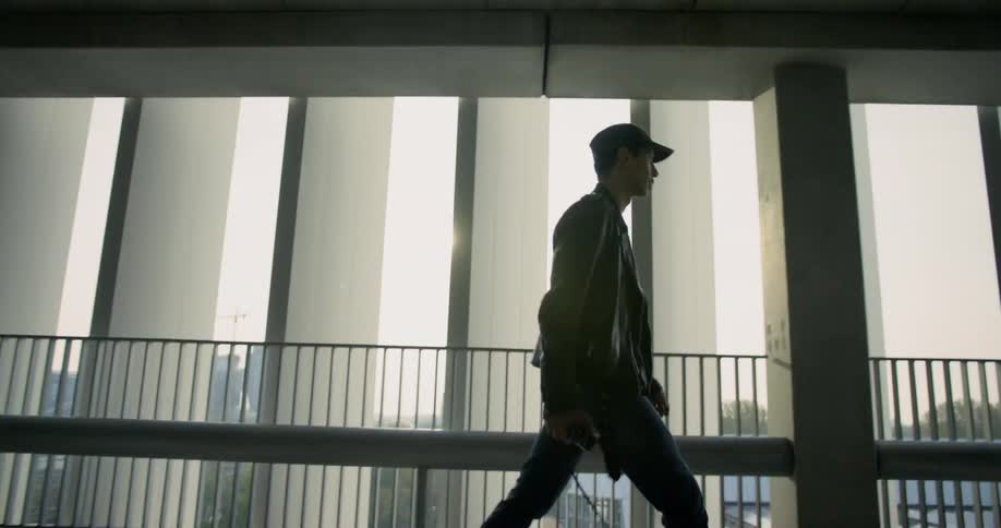 Man walks along the corridor of the building