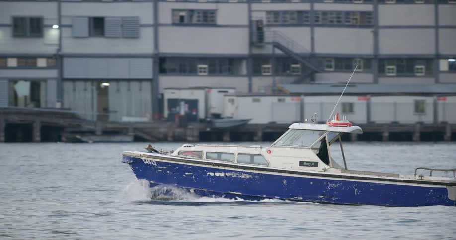 A boat is driving in the water